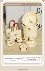 Cartoon duck bathroom set including a washbasin, bucket, and storage caddy in cream yellow