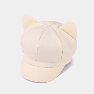 Detail view of cute cat ears on a beige cotton octagonal hat with twill texture