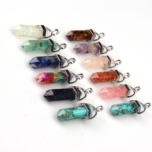 Close-up of twelve hexagonal crystal pendants in diverse natural stones and colors