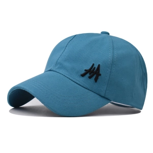 Close-up of cotton baseball cap fabric texture and black HA letter embroidery