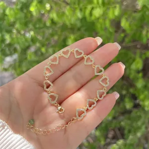 Detail of 18K gold plated hollow heart bracelet with white zircon pave and lobster clasp