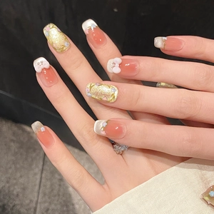 Pink gradient handmade press-on nails with white 3D bows and golden glitter accents