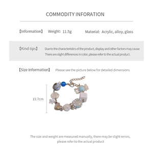 Detailed size specifications for the blue beaded bow bracelet with length measurement