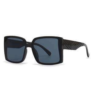 Classic black oversized square sunglasses with stylish textured V-shape pattern on the temples