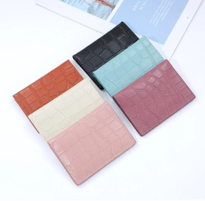 Flat lay of multi-color stone texture card holders with elegant crocodile pattern