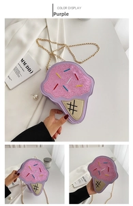 Detail view of purple ice cream crossbody bag with pink sequins and gold chain strap