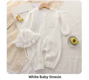 White cotton gauze long-sleeve baby romper set with matching ruffled sun hat