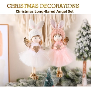 Detailed view of pink and white plush angel ornaments with tulle skirts and golden wings