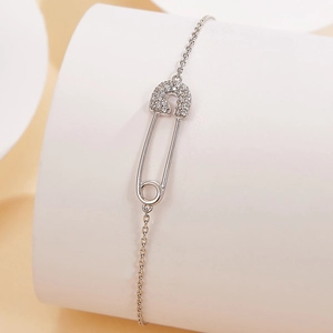 S925 sterling silver paperclip bracelet with pavé-set cubic zirconia on display stand