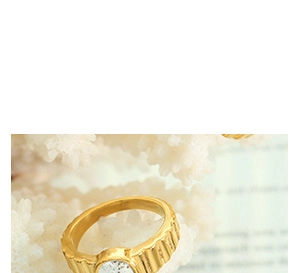 Detailed view of 18k gold plated C-shaped ring with vertical grooves and round zircon stone