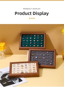 Three walnut finish jewelry trays with colorful velvet slots for ring display