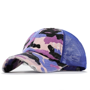 Distressed camouflage ponytail baseball cap with purple and pink mesh panels