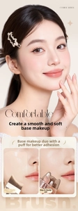 Detailed view of makeup foundation brush and cat-ear puff for smooth base application
