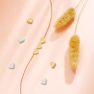 Golden and silver heart-shaped alloy spacer beads with a matching rose gold necklace