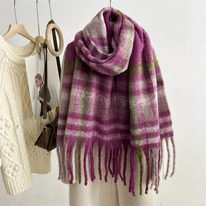 Detail of soft mohair texture and fringe on purple and olive green checkered scarf