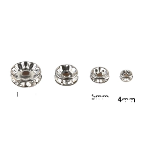 Silver plated DIY spacer beads with white crystals in 4mm and 5mm sizes on white background