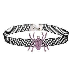 Detail of black mesh choker featuring a sparkling purple spider pendant and silver clasp