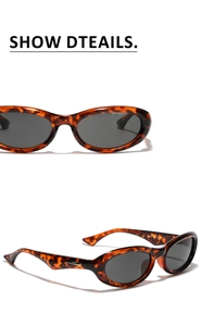 Detail view of tortoiseshell oval sunglasses with dark gray lenses and silver hinges