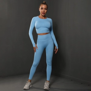 Light blue seamless yoga set with long sleeve thumbhole top and high waist leggings