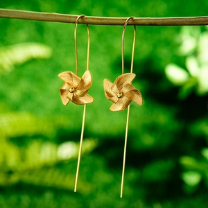 Artistic S925 sterling silver windmill drop earrings with long gold chain on a branch