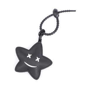 Cute black star-shaped leather keychain with cartoon face and plastic carabiner clip
