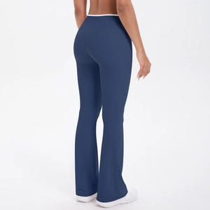 Rear view of high-waisted navy flare yoga pants with contrast white waistband detail