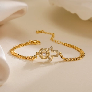 18K gold plated evil eye cubic zirconia bracelet with pearl on silk background
