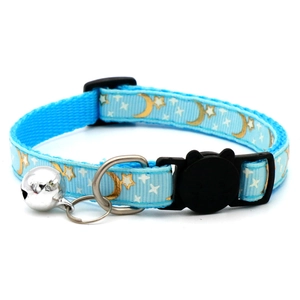 Blue pet collar with gold moon and star patterns, featuring a black cat buckle and bell