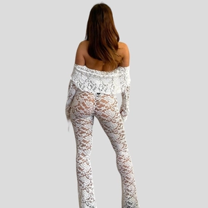 White lace hollow-out two-piece set featuring off-shoulder top and flared trousers back view