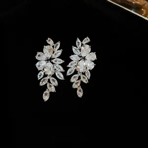 Silver needle leaf tassel earrings with sparkling pear cut cubic zirconia on black velvet