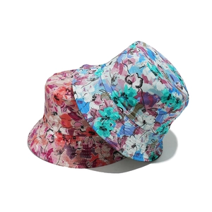 Women's reversible floral sun hats with colorful abstract patterns for summer beach travel