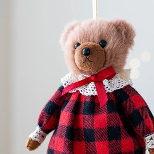 Cute teddy bear plush keychain wearing red plaid dress with lace and ribbon bow