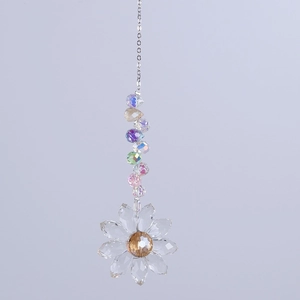 Macro shot of colorful faceted crystal beads and flower pendant on silver chain