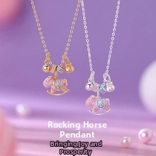 Detail of pink enamel rocking horse pendant necklace with bell in gold and silver