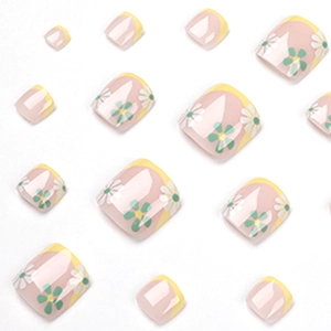 French tip press-on toenails with white and green daisy floral design on nude base