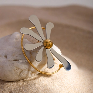 Detail of a two-tone flower cuff bracelet made of gold and silver stainless steel