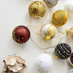 Champagne and red Christmas tree ornaments set with glitter sequins and bead details