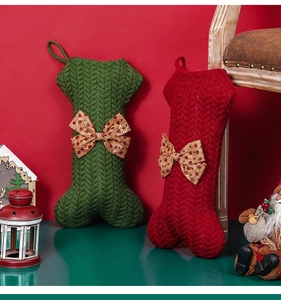 Close-up of cable knit bone-shaped Christmas stockings with festive sequin bows