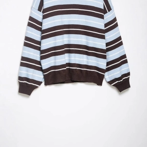 Striped knit sweater with long sleeves and ribbed cuffs in blue and brown pattern