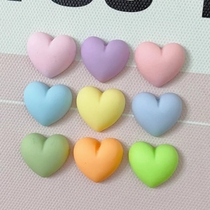 Macro shot of 9 colorful matte resin heart charms arranged in a grid for DIY crafts
