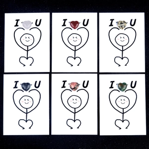 Healing cards with various natural crystal heart stones and matchstick figures