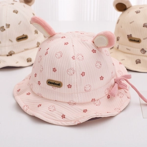 Detail of pink cotton baby sun hat featuring 3D bunny ears and cute rabbit patterns