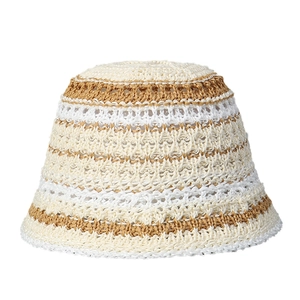 Handmade striped crochet bucket hat in beige and camel for a classic summer sun protection look