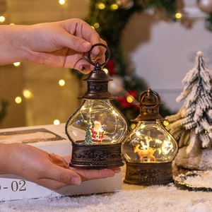 Retro Christmas LED lantern featuring Santa and Reindeer scenes in vintage bronze finish