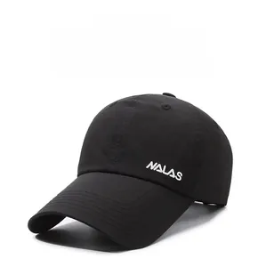 Detail of embroidered NALAS logo and reinforced stitching on black baseball cap