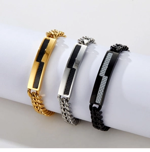 Detailed shot of gold, silver, and black Cuban bracelets with carbon fiber inlay