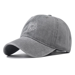 Close-up of grey washed cotton baseball cap featuring white sun embroidery detail