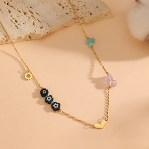 Bohemian gold chain necklace with colorful natural stones, sun, heart and flower charms