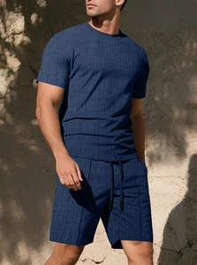 Detailed macro view of navy blue waffle texture fabric on men's casual summer set