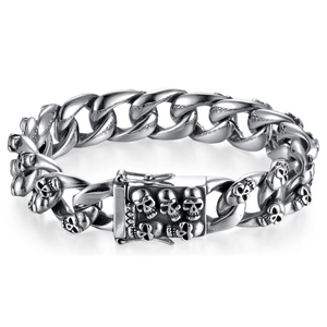 Close-up of silver punk skull bracelet with a large sturdy clasp on white background